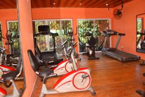 a gym with several exercise bikes in a room at Hôtel Restaurant Gites Kribi in Kribi