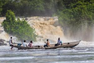 a group of people sitting on a boat in the water at Hôtel Restaurant Gites Kribi in Kribi