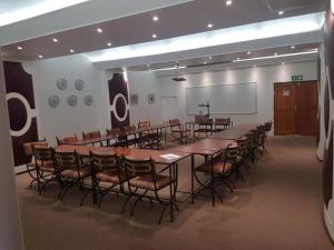 a conference room with a long table and chairs at The Sunset Villas in Velddrif