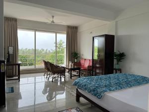 Ένα ή περισσότερα κρεβάτια σε δωμάτιο στο The Ashvem Horizon