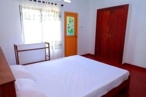 Postel nebo postele na pokoji v ubytování WindGet Villa