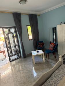 a living room with a couch and a table at My Dream in Manduar +9 photos