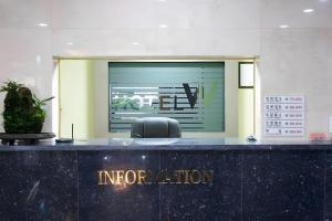 an entrance to an office with a sign on the counter at Hotel W Shinjeju in Jeju