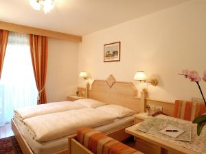 Postel nebo postele na pokoji v ubytování Hotel La Müda
