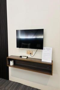 a flat screen tv sitting on a wall at Casa Colney Hotel Ipoh in Ipoh