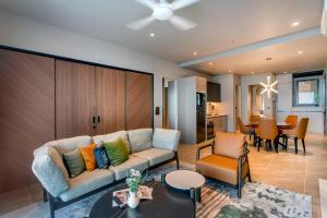 a living room with a couch and a table at Antara Genting Highlands by COBNB - near Link Bridge in Genting Highlands +158 photos