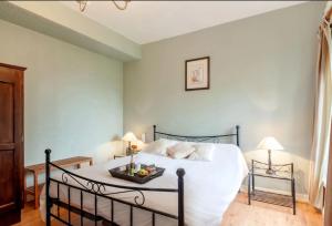 Postel nebo postele na pokoji v ubytování Domaine Le Prieuré