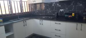 Η κουζίνα ή μικρή κουζίνα στο NEO HOME Gbawe