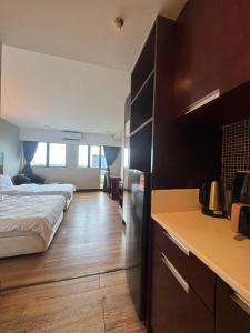 Ένα ή περισσότερα κρεβάτια σε δωμάτιο στο VY suites studio room SCSP Ming Garden Kota Kinabalu +6 φωτογραφίες