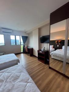 Ένα ή περισσότερα κρεβάτια σε δωμάτιο στο VY suites studio room SCSP Ming Garden Kota Kinabalu