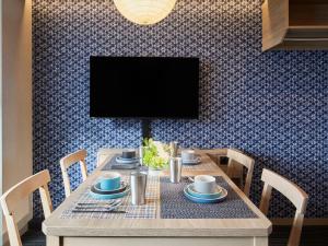 TV a/nebo společenská místnost v ubytování Minn Nishi Kasai + 9 fotografií