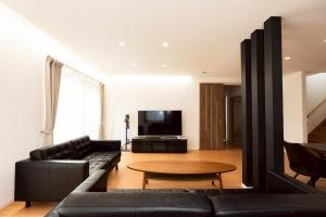 Un televizor și/sau centru de divertisment la スターレジデント