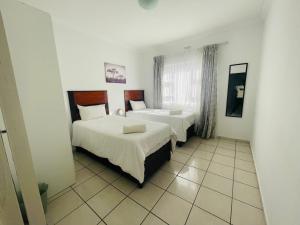 Postel nebo postele na pokoji v ubytování HinterlandLodge