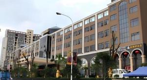 a large building with a street light in front of it at Jie Hao Royal Hotel in Fenghuangwei