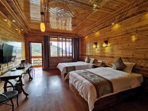 Ένα ή περισσότερα κρεβάτια σε δωμάτιο στο Yiran Residence Hotel, Longsheng County