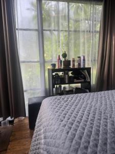 Postel nebo postele na pokoji v ubytování The Glass house