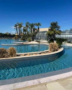 Πισίνα στο ή κοντά στο Mobil-Home, camping LES DUNES 5 étoiles, 6 personnes