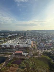 an overhead view of a large building in a city at Pollux Habibie Deluxe 3 City View lt 28 by Superstay in Batam Center