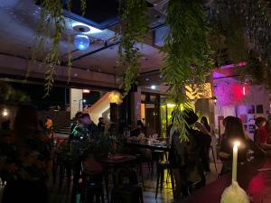 a group of people sitting at tables in a restaurant at Hotel Stay Interview Jeju in Seogwipo