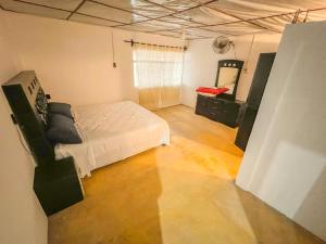 Ένα ή περισσότερα κρεβάτια σε δωμάτιο στο Casa San Angel