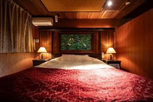 Postel nebo postele na pokoji v ubytování ホテルミント羽島