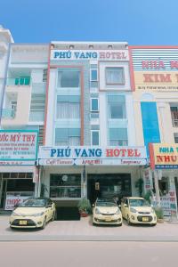 three cars parked in front of a hotel at Phú Vang Hotel Pleiku in Pleiku