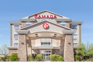 a building with a karma sign on top of it at Ramada by Wyndham Brooks in Brooks
