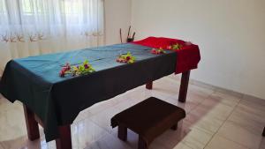 a table with flowers on it in a room at Aetos Wellness - Tangalle in Tangalle