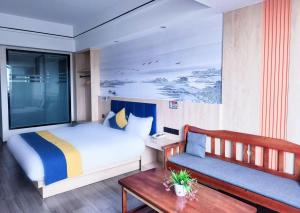 Postel nebo postele na pokoji v ubytování Wang Tian Shu Value Resort Hotel