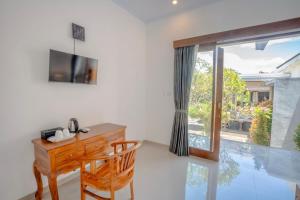 TV a/nebo společenská místnost v ubytování Moringa Pandawa Guest House + 6 fotografií