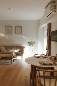 a living room with a couch and a table at Studio&Stay Room in Ghent