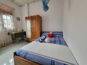 Ένα ή περισσότερα κρεβάτια σε δωμάτιο στο Green House No 02