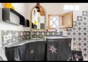 a bathroom with a sink and a mirror at La Casa del Cine en Níjar in Níjar +78 photos