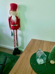 a santa claus figurine standing next to a table at Buda Side Comfort in Budapest
