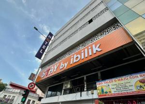a building with a sign that saysskip by on it at Swing & Pillows - Chow Kit Road, Kuala Lumpur in Kuala Lumpur