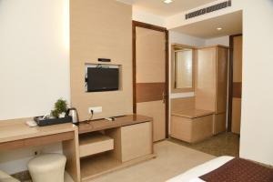 TV a/nebo společenská místnost v ubytování Hotel The Emporio A Boutique Rooms