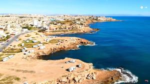 an aerial view of a beach near the ocean at La Mata primera línea de playa in Torrevieja