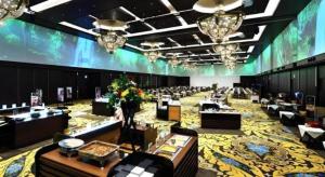 a large room with tables and chairs and a large room with a large at Shiratamano Yu Kahou in Shibata