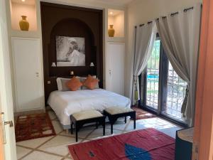 Postel nebo postele na pokoji v ubytování Riad Lalla Rita Marrakech + 35 fotografií