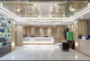 a lobby of a dog house with a reception desk at Chenlong Cafe Hotel in Guangzhou