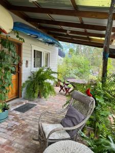 a patio with two chairs and a table and a table at Lower Mountains Retreat in Warrimoo +16 photos