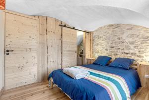 Ένα ή περισσότερα κρεβάτια σε δωμάτιο στο Gite du lézard