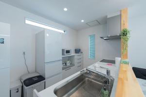 Køkken eller tekøkken på ガーデンヴィラミヤコアネックスエー