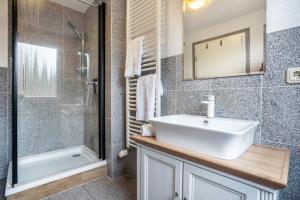 a bathroom with a sink and a shower at Kranich in Pruchten +22 photos