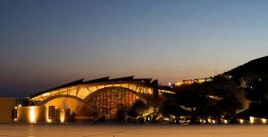 a large building with lights on it at night at Albergo San Michele in San Giovanni Rotondo