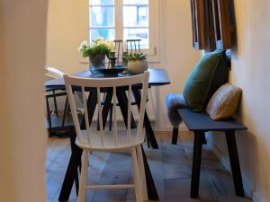 a dining room with a table and two chairs at N5Quartier in Bad Münstereifel