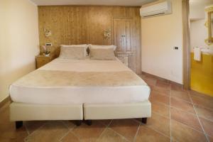 Voodi või voodid majutusasutuse Dimora Storica Hotel Maccarunera toas