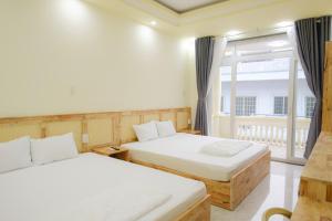 Ένα ή περισσότερα κρεβάτια σε δωμάτιο στο De Rivé Homestay 2 - Bến Ninh Kiều