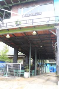 a building with a sign that reads lives polonia at Wong Pai Ton Villa in Ngadisari +7 photos