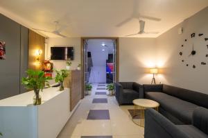 a living room with a couch and a table at BedChambers Serviced Apartment, Medicity in Gurgaon